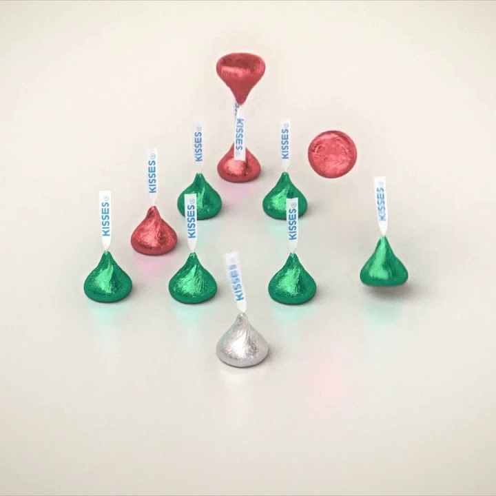 Frame from the Hershey's Kisses commercial where the Kisses ring like handbells, playing We Wish You a Merry Christmas