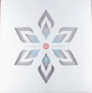 Cover of the Target's The Christmas Gig: Two Thousand Ten, featuring a cutout snowflake, showing the clear vinyl record through the cover.